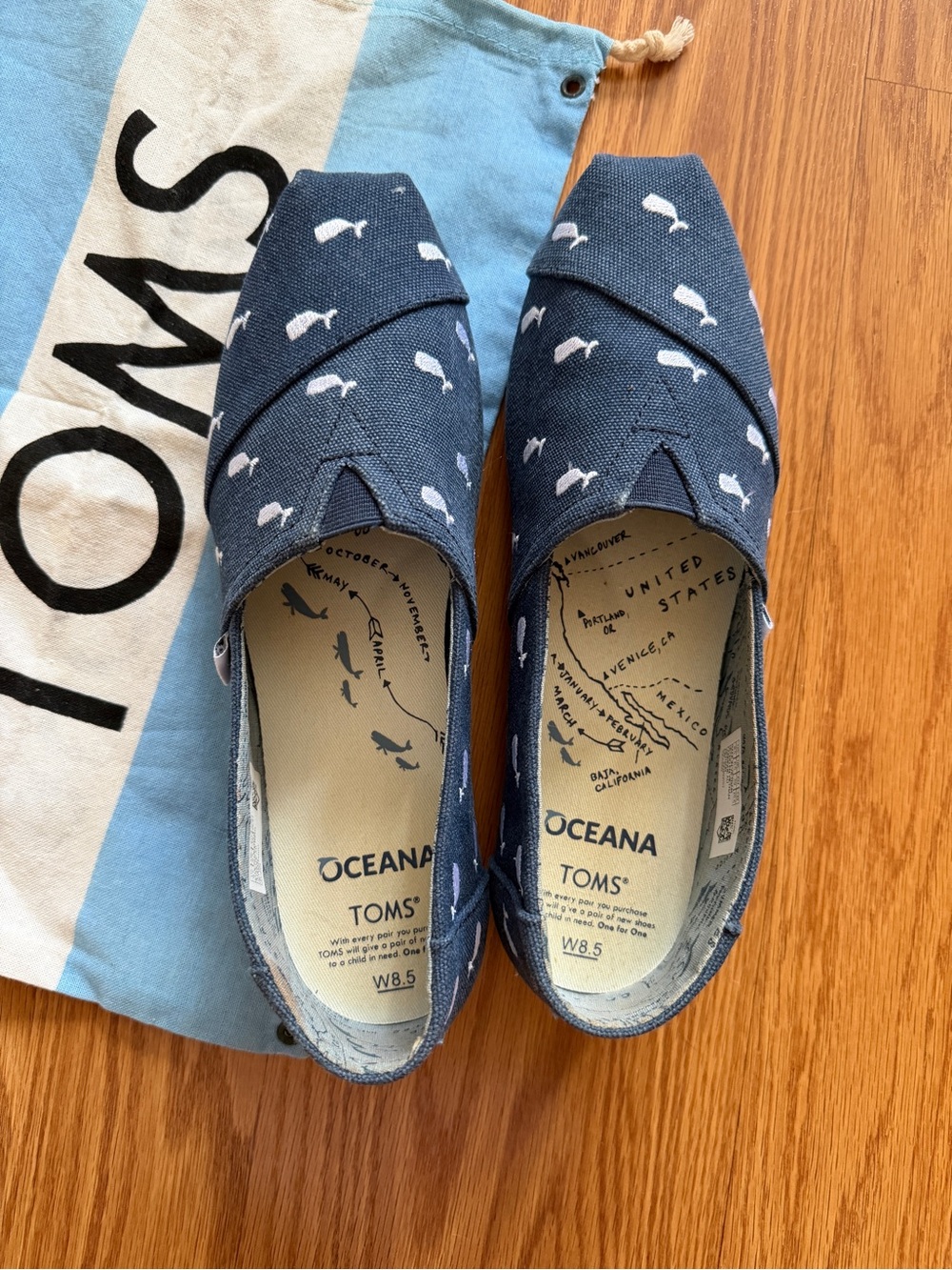 TOMS Oceana Navy Canvas Slip-Ons with White Whale Print